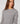 Long-sleeve peplum sweater - Gris